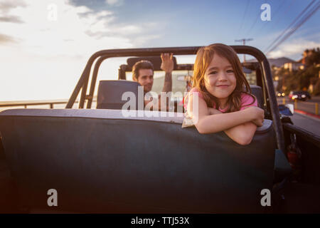 Portrait of happy girl with father in pick-up truck Stock Photo