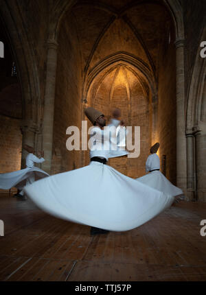 Nicosia, Cyprus, June 5 2019: Group of Dervishes performing the traditional and religious whirling dance or Sufi whirling Stock Photo
