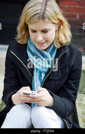 Woman using smart phone Stock Photo
