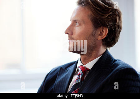 Thoughtful businessman looking away Stock Photo