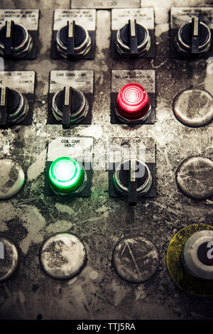 Close-up of buttons on messy control panel at metal industry Stock Photo