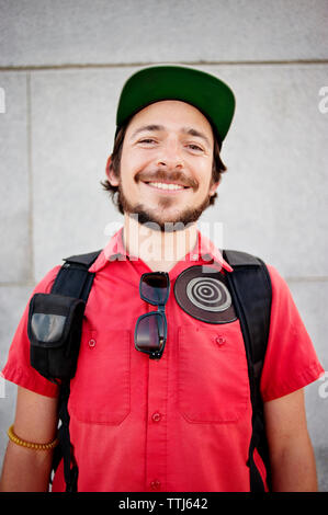 Portrait of smiling man standing against building Stock Photo