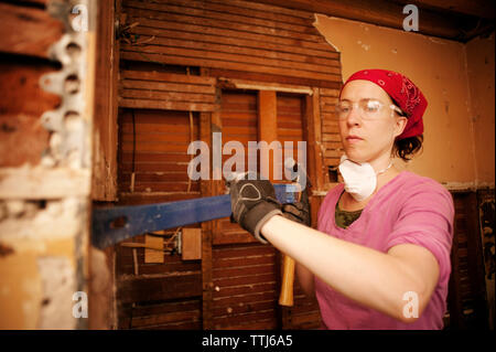 Confident manual worker working at home Stock Photo