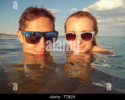 Portrait of couple in sea Stock Photo