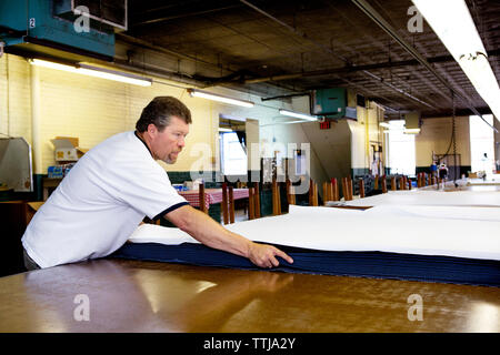 Man working in factory warehouse Stock Photo
