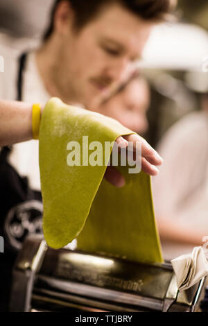 Close-up of chef making pasta at commercial kitchen Stock Photo