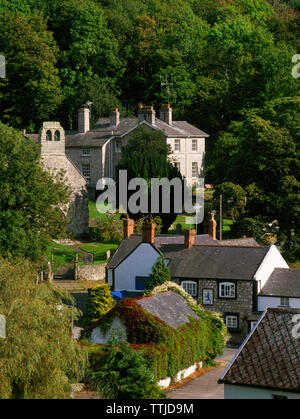 View SE over Cwm village, Denbighshire, UK, including the Blue Lion Inn, St Mael & St Sulien's C14th church & former vicarage Ty Cerrig (centre rear). Stock Photo