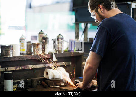 Portrait of manual workers standing in workshop Stock Photo