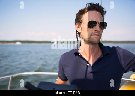 portrait of man traveling in yacht Stock Photo