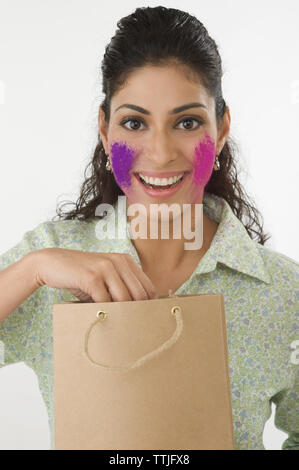 Woman celebrating holi festival Stock Photo