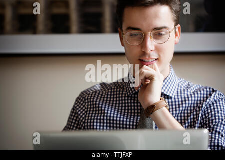 Man using laptop computer at home Stock Photo