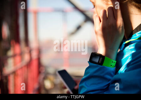 Cropped image of woman using smart phone Stock Photo
