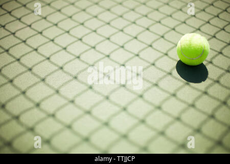 Tennis ball in court Stock Photo
