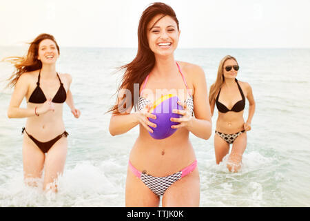 Portrait of women standing in sea Stock Photo