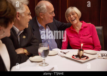 Senior friends in restaurant Stock Photo