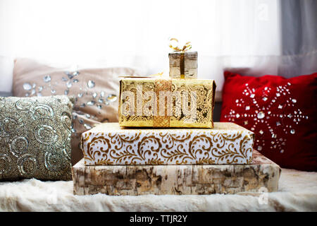 Gift boxes and cushions on alcove window seat Stock Photo