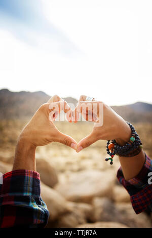 Cropped image of hands making heart shape Stock Photo