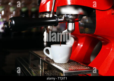 https://l450v.alamy.com/450v/ttjxt1/coffee-machine-with-cup-close-up-ttjxt1.jpg