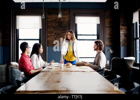 business people in board room during meeting in office Stock Photo