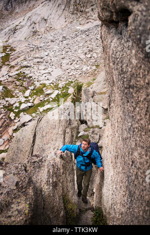 High angle view of man hiking on rock formations Stock Photo