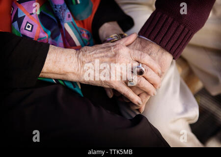 Close-up of senior couple holding hands Stock Photo