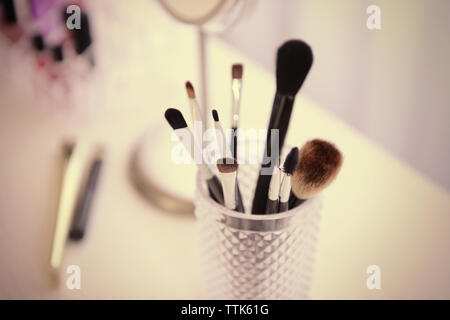 Cosmetic set on light dressing table Stock Photo