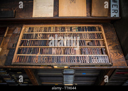 High angle view of alphabets and numbers letterpress at workshop Stock Photo