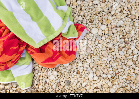 High angle view of towels on stones in backyard Stock Photo