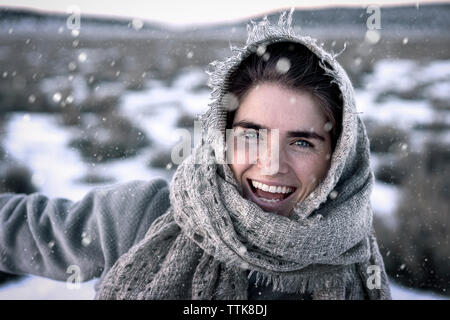 Close-up portrait of cheerful woman during winter Stock Photo