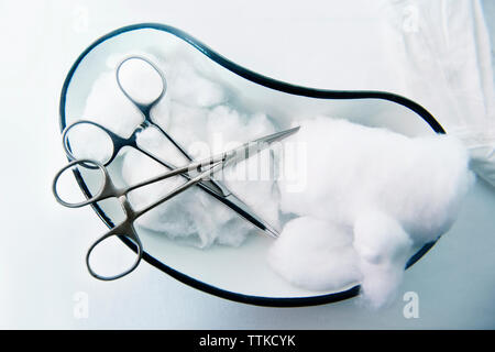 Overhead view of scissors and cotton on table in hospital Stock Photo