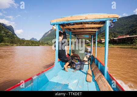 Boat trip on the Nam Ou River looking north at Muang Ngoi Neua, Muang Ngoi District, Luang Prabang Province, Northern Laos, Laos, Southeast Asia Stock Photo