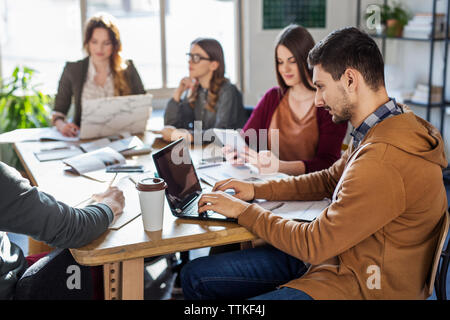 Students studying in college classroom Stock Photo