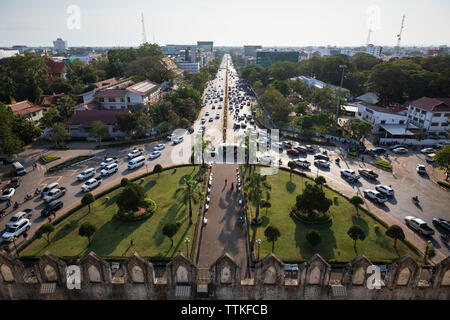 View along Lane Xang Avenue viewed from the top of the Patuxai Victory Monument (Vientiane Arc de Triomphe), Vientiane, Laos, Southeast Asia Stock Photo