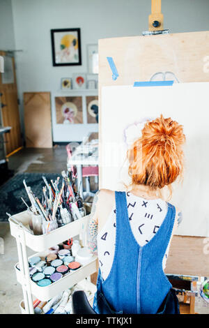 Artist Rearh Rear view of artists working in recording studio Stock Photo - Alamy
