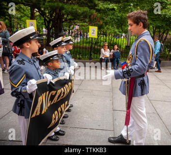 Cadets from the Knickerbocker Greys after-school organization  in the annual Flag Day Parade in New York on Friday, June 14, 2019, starting at New York City Hall Park.  Flag Day was created by proclamation by President Woodrow Wilson on June 14, 1916 as a holiday honoring America's flag but it was not until 1949 when it became National Flag Day.  The holiday honors the 1777 Flag Resolution where the stars and stripes were officially adopted as the flag of the United States. (© Richard B. Levine) Stock Photo