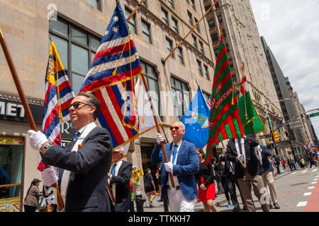 Marchers in the annual Flag Day Parade in New York on Friday, June 14, 2019, starting at New York City Hall Park.  Flag Day was created by proclamation by President Woodrow Wilson on June 14, 1916 as a holiday honoring America's flag but it was not until 1949 when it became National Flag Day.  The holiday honors the 1777 Flag Resolution where the stars and stripes were officially adopted as the flag of the United States. (© Richard B. Levine) Stock Photo
