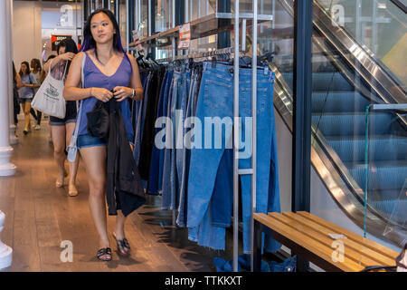 Shoppers browse the sales at the TopShop/TopMan store in Soho in New York on Saturday, June 15, 2019.  The Arcadia Group, the owner of the TopShop chain, announced that it will file for Chapter 15 bankruptcy protection in the U.S. and close its 11 stores here. (© Richard B. Levine) Stock Photo