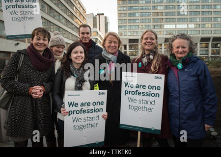 St Thomas' Hospital, London, UK. 12th January, 2016.  Groups of medical staff assemble outside St Thomas' Hospital in London in support of the NHS Str Stock Photo