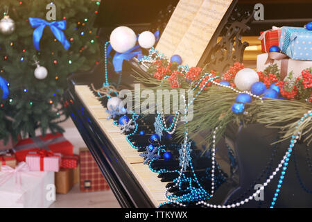 Piano with Christmas decoration Stock Photo