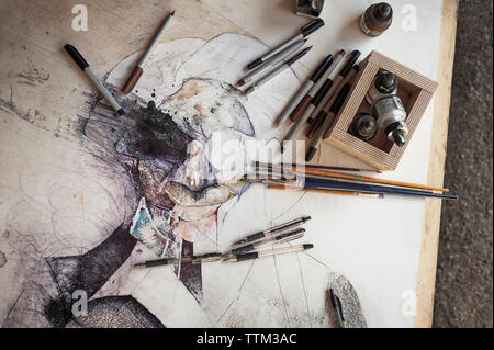 Overhead view of equipment on canvas at home Stock Photo