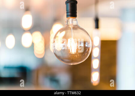 Close-up of illuminated light bulb Stock Photo