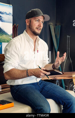 Craftsperson taking notes Stock Photo