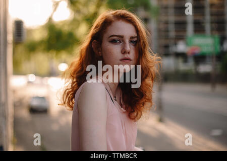 Portrait of young red head woman with freckles Stock Photo
