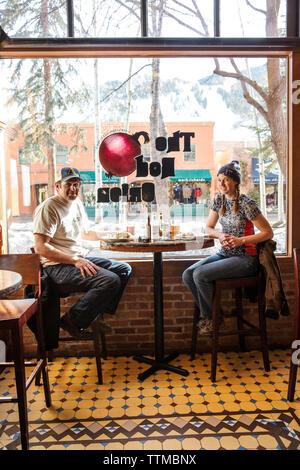 USA, Colorado, Aspen, a couple has lunch at The Red Onion restaurant in downtown Stock Photo