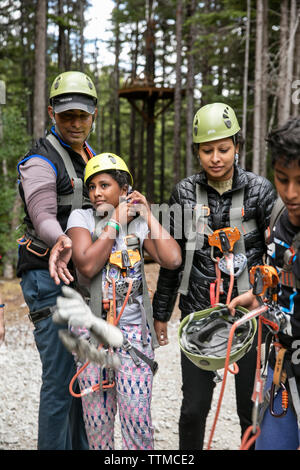 USA Alaska, Sitka, participants prepare for their 4-hour adventure where they will zip past massive spruce, cedars and glacially fed waterfalls, Grizz Stock Photo