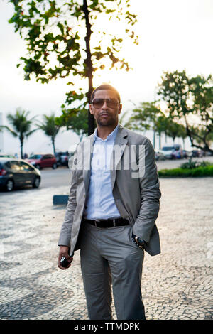 BRAZIL, Rio de Janiero, a man stands outside of hotel Fasano, located near Ipanema Beach Stock Photo