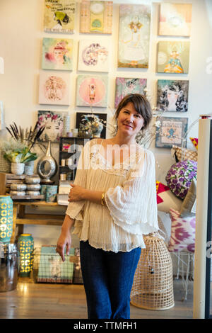 USA, Oregon, Ashland, shop employee Zoe at the retail store Papaya Living on North Main Street in downtown Stock Photo