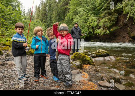 USA, Oregon, Santiam River, Brown Cannon, young boys showing off the fish they caught in the Santiam River Stock Photo