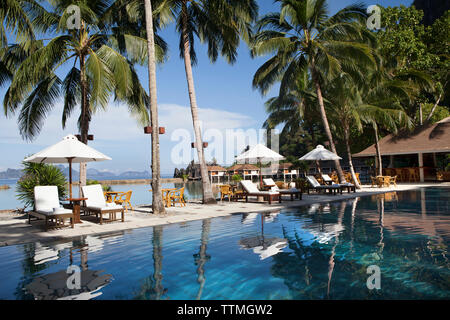 PHILIPPINES, Palawan, El Nido, poolside view at the Lagen Island resort in Bacuit Bay in the South China Sea Stock Photo