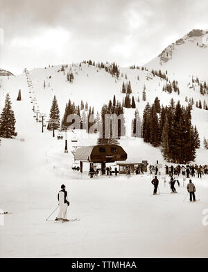 USA, Utah, skiers at the base of the Sugarloaf chair lift, Alta Ski Resort (B&W) Stock Photo